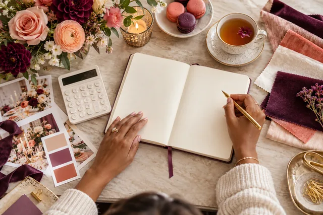 Notebook and calculator on an event planning desk